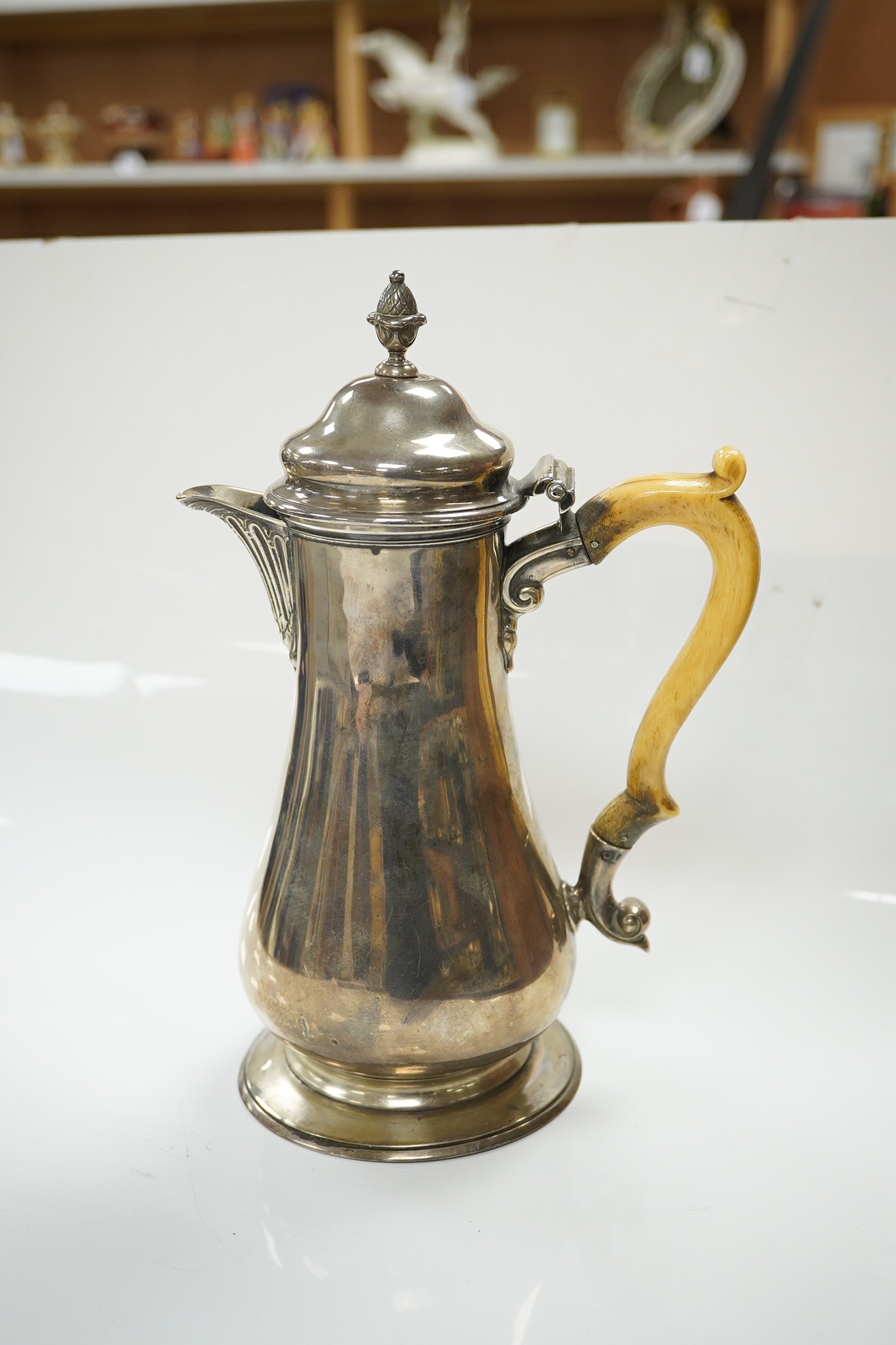 A George V silver baluster hot water pot with ivory handle, makers James Dixon & Sons, Sheffield 1915, gross 19.5 oz, fair to good condition. CITES Submission reference QELNYL3Z